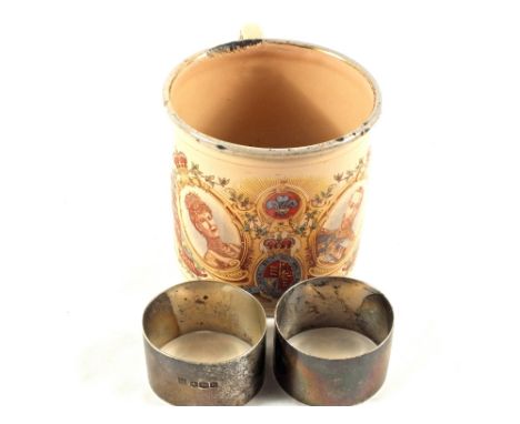 Two Silver serviette rings and a 1902 enamel Coronation mug