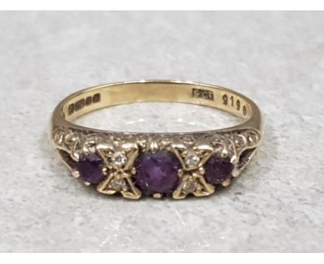 A 9ct yellow gold amethyst and diamond 7 stone ring, size M 1/2, 2.3g gross.