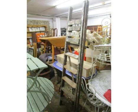 A vintage wooden Drews patent folding step ladder 