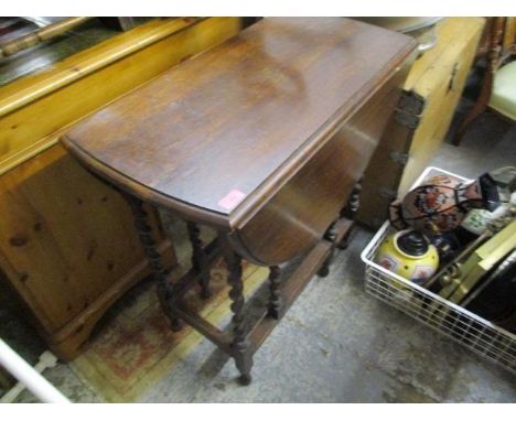 A 1930s oak barley twist gate leg table, 29" x 30" x 15 1/2" (when un-extended) 