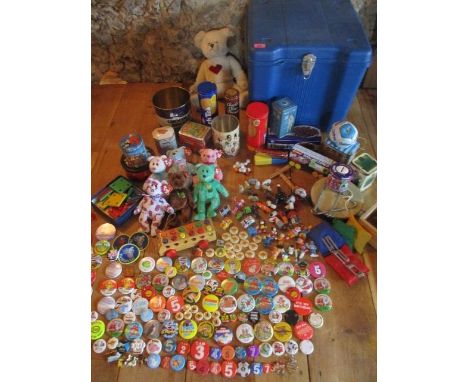 A substantial retro collection of badges to include enamelled Golly badges and a BMW 520 car badge, together with mixed toys,