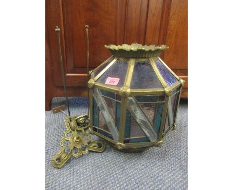 A brass framed coloured glass ceiling hanging light 