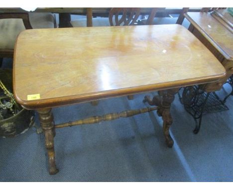 A Victorian mahogany occasional table with ring turned, vase shaped columns, acanthus carved turned cabriole legs, standing o