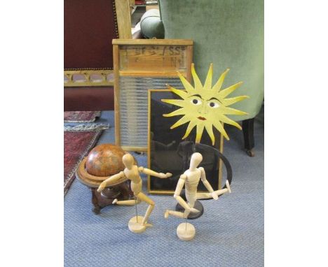Two treen jointed ornamental dummies, a vintage hand wash board, a metal ornamental rocking sun with moveable eyes, a vintage