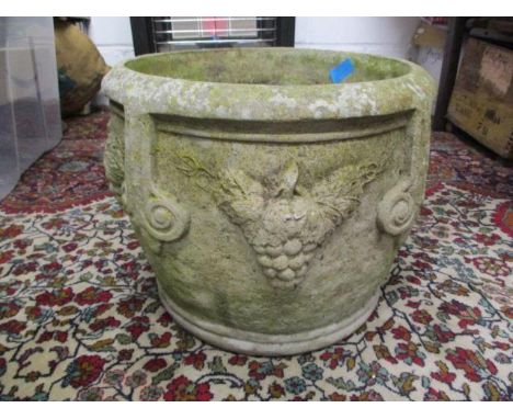 A weathered composition stone garden planter, 15" dia 