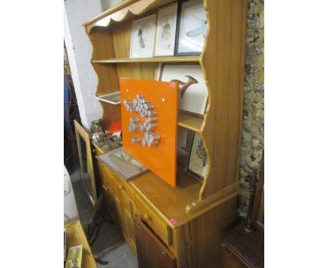 A modern light wood dresser 79"h x 69"w 