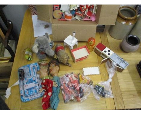 Teddies and doll related items to include Barbie furniture, a Steiff elephant, carved wooden hand puppets, a German tin plate