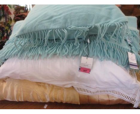 A gold coloured and padded eiderdown, an oversized scatter cushion, a Jasper Conran throw and matching cushion, new with tags