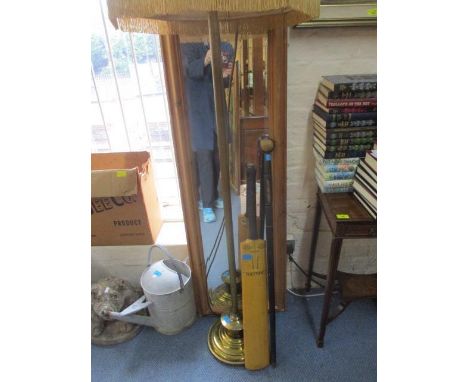 A mid 20th century brass standard lamp with a cream shade, a modern pine mirror, a Gunn &amp; Moore Ltd cricket bat and a tri