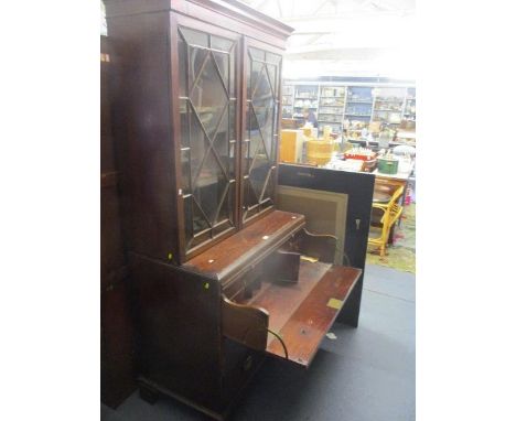 A 19th century mahogany and pine bookcase cabinet with secretaire drawer over two long drawers, on bracket feet 