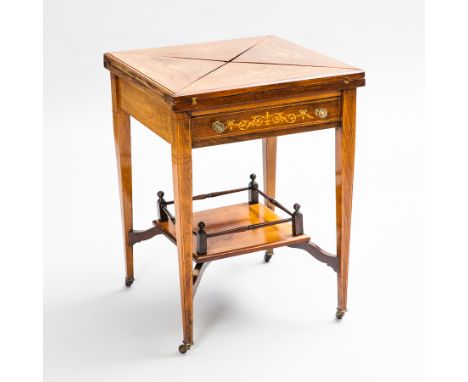 LATE VICTORIAN ENVELOPE CARD TABLE
with marquetry inlay on tapering legs and casters, with a galleried shelf, 73cm high, 55cm