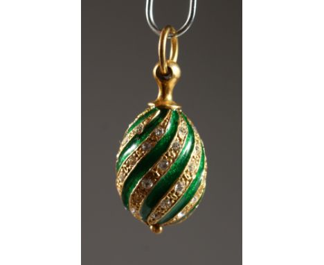 A RUSSIAN SILVER AND ENAMEL MINIATURE EGG PENDANT. 0.75ins high.