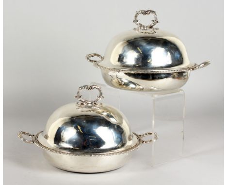 A GOOD PAIR OF GEORGE III PAUL STORR CIRCULAR TWO-HANDLED VEGETABLE TUREENS AND COVERS, with reeded handles and gadrooned edg