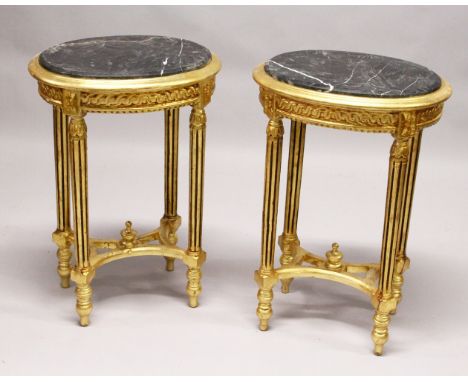 A PAIR OF FRENCH STYLE GILTWOOD ND MARBLE TOP OVAL LAMP TABLES. 2ft 5ins high x 1ft 8ins wide x 1ft 3ins deep.
