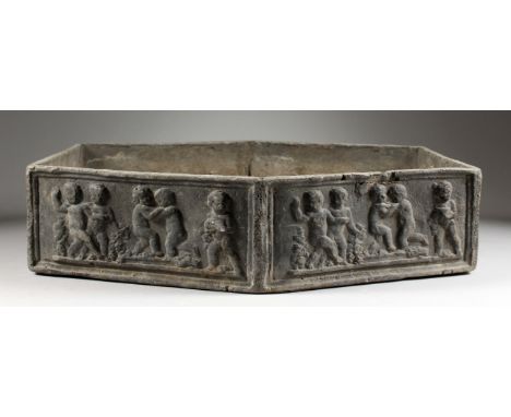 A SMALL LEAD PLANTER, of flattened hexagonal form, the sides depicting cherubs. 19.5ins long x 16ins wide x 4.75ins deep.