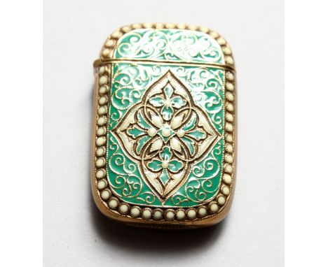 A NOVELTY ENGRAVED BRASS AND CLOISONNE ENAMEL VESTA CASE.