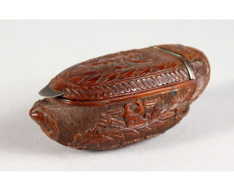 A GOOD CARVED COQUILLA NUT SNUFF BOX. 3ins long.