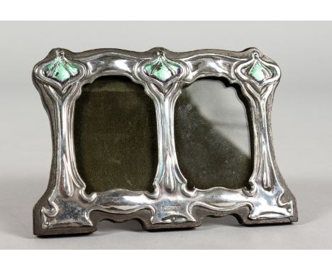 AN ART NOUVEAU STYLE SILVER AND ENAMEL DOUBLE PHOTOGRAPH FRAME. 4.5ins wide x 3ins high.