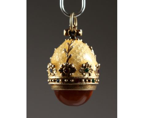 A RUSSIAN SILVER AND ENAMEL MINIATURE EGG PENDANT. 0.75ins high.