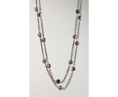 A SILVER AMETHYST SET LONG CHAIN.