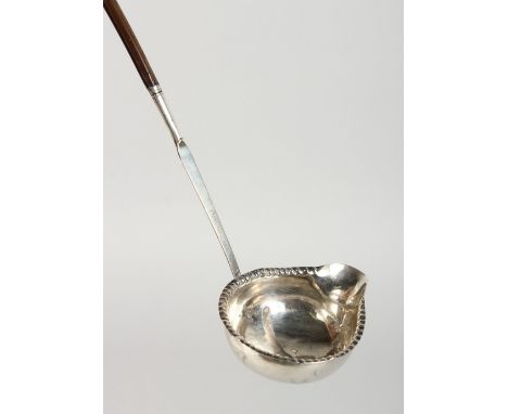 A SILVER TODDY LADLE.
