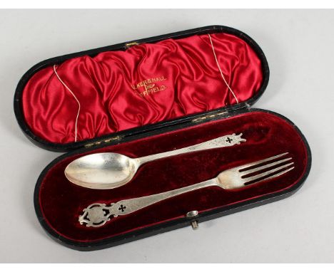 A WALKER &amp; HALL SILVER CHRISTENING SPOON AND FORK in a fitted case. Chester 1906.