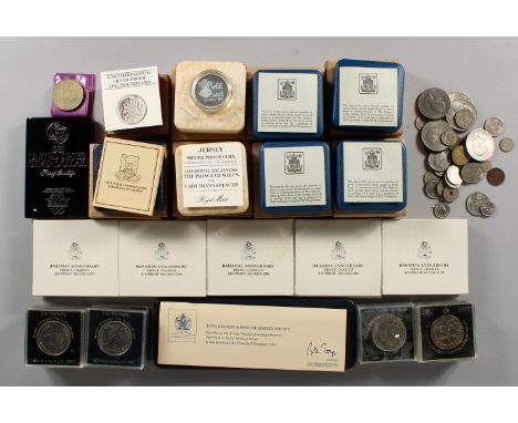 A QUANTITY OF ROYAL COMMEMORATIVE AND OTHER COINS, contained in a black Japanned tin trunk.