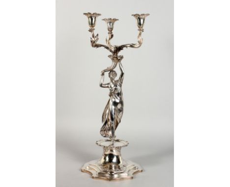 A GOOD VICTORIAN SILVER TABLE CENTRE CANDELABRA, with three scrolling branches emanating from a cornucopia being held aloft b