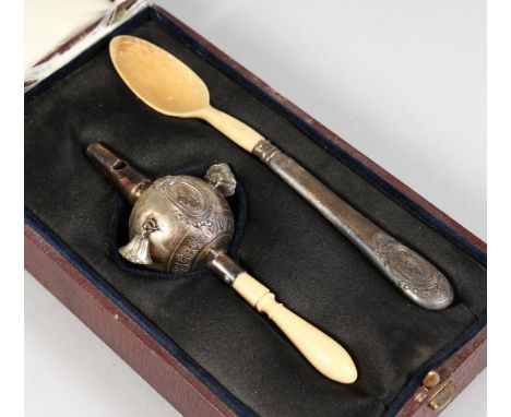 A VICTORIAN BABIES SILVER AND IVORY RATTLE, with whistle and a spoon in a fitted leather case.