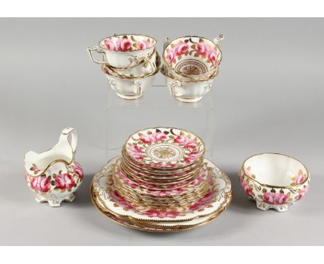 A TEA SET, with gilt decoration painted with roses, comprising seven cups, seven saucers, five small plates, two large plates