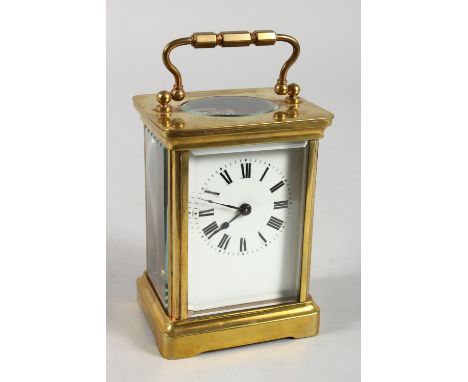 A 19TH CENTURY FRENCH BRASS CARRIAGE CLOCK TIMEPIECE. 4.5ins high.