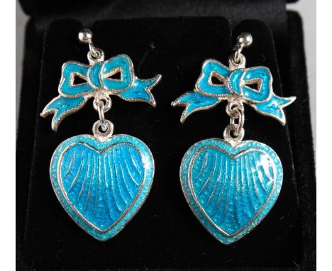 A PAIR OF SILVER AND BLUE ENAMEL HEART AND BOW EARRINGS.