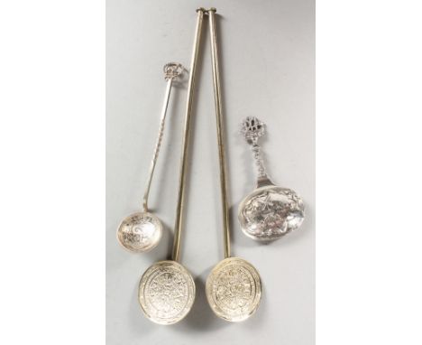 A PAIR OF STERLING SILVER GILT SPOONS, a caddy spoon and a coin spoon (4).