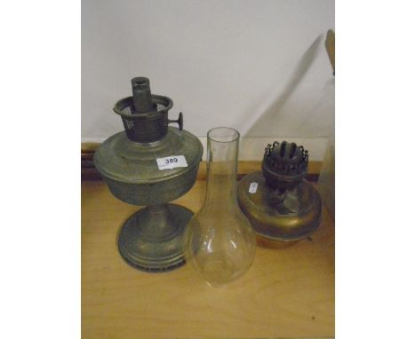 Metal oil lamp and brass oil lamp missing stand plus glass oil lamp chimney