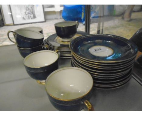 Part tea matching service of plates, cups and saucers in blue and gold