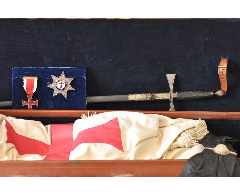 A Masonic Knights Templar case 40" long containing a sword, scabband with frog, mantle, sash cap with badge, gauntlets, star 