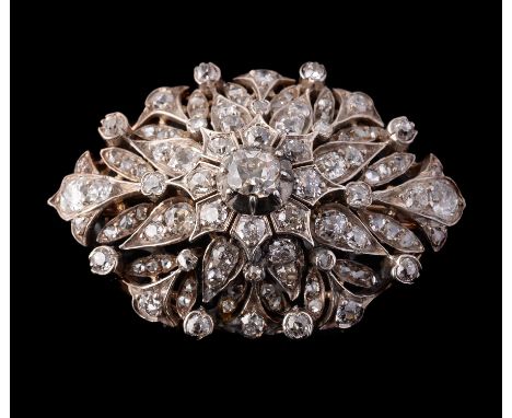 A late 19th century diamond starburst brooch, circa 1890, set throughout with cushion shaped old brilliant cut and rose cut d