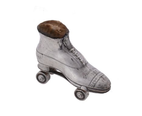 An Edwardian silver novelty roller skate pin cushion by Crisford & Norris Ltd., Birmingham 1909, engraved Strand Lodge 1987 1