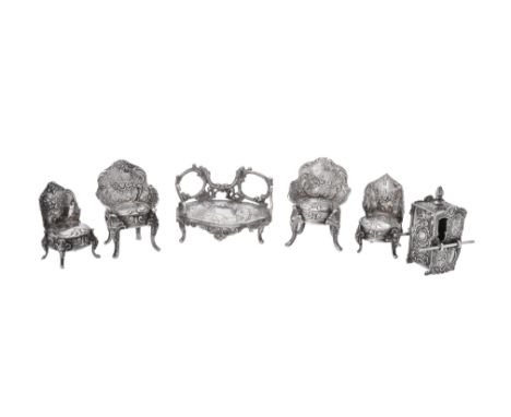 A collection of silver miniature furniture, comprising: a two seater sofa, import marked for London 1896, sponsor's mark of B