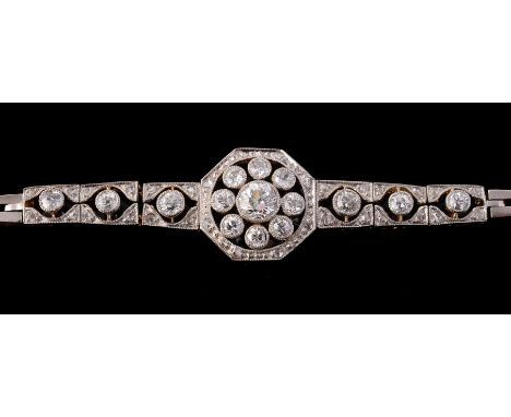 An early 20th century diamond bracelet, circa 1910, the central articulated panels set with old brilliant cut and rose cut di