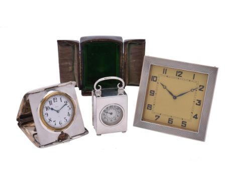 Three silver mounted desk timepieces, comprising: one Edwardian by The Goldsmiths & Silversmiths Co. Ltd, London 1904, with a