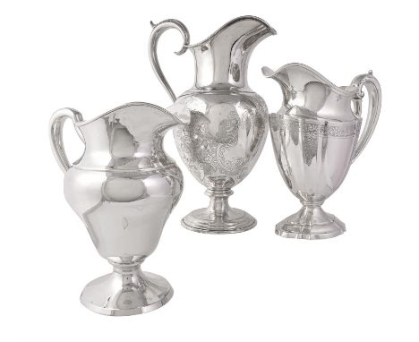 Three American silver water pitchers or jugs, the tallest by Gorham & Co., stamped marks for circa 1852-65 and Coin, pedestal