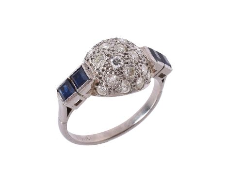 A 1960s diamond and sapphire bombé dress ring, the central bombé panel set with brilliant cut diamonds, approximately 0.63 ca