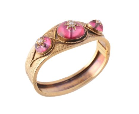 A late Victorian gold, foiled quartz and half pearl hinged bangle, circa 1880, the three pink foiled quartz cabochons inset w