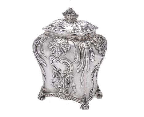 A Victorian silver oblong baluster tea caddy by Thomas Bradbury & Sons, London 1895, with a foliate finial to the foliate cha