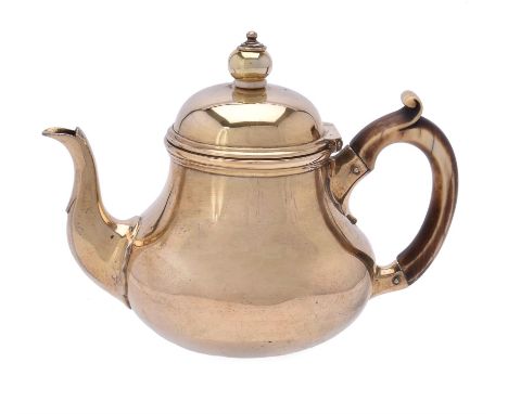 Y A Victorian silver gilt baluster bachelor tea pot by R. & S. Garrard & Co., London 1852, with a ball finial with ivory spac