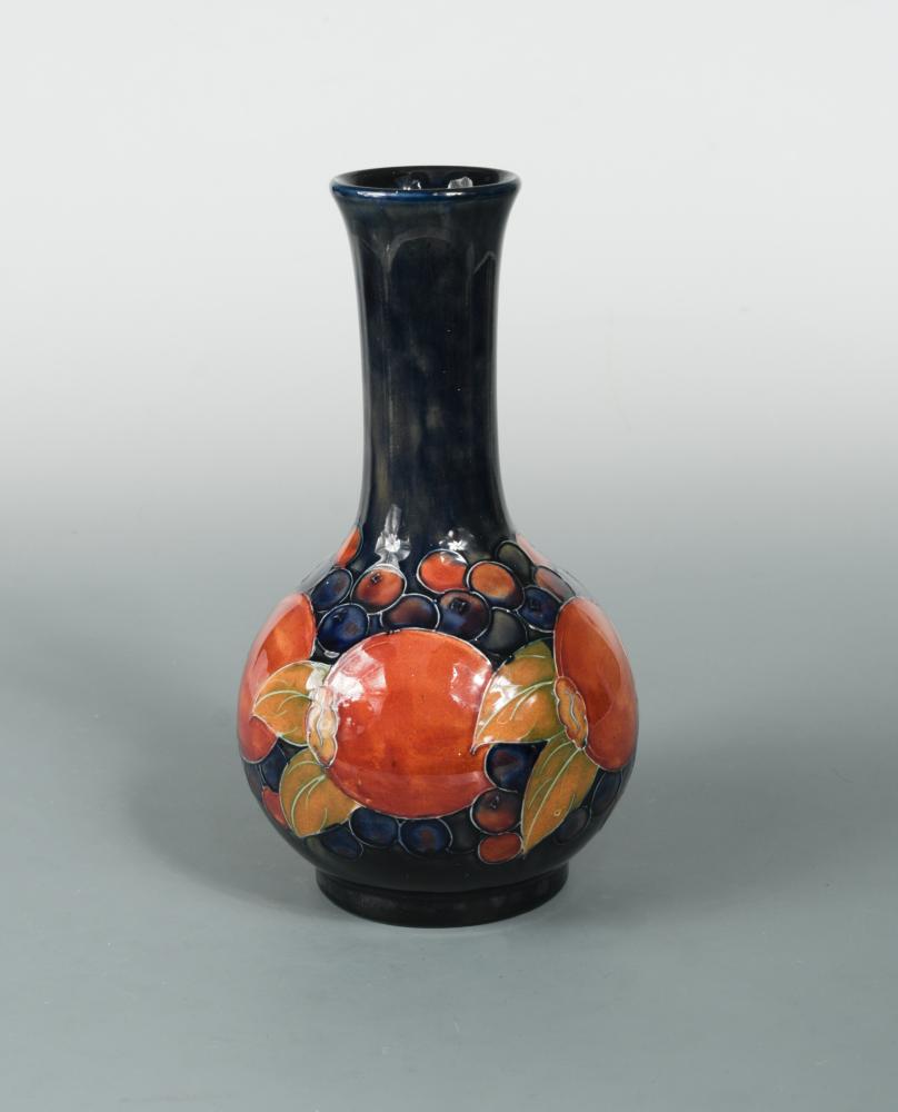 A Moorcroft Pomegranate Pattern Bottle Vase The Fruits Painted To