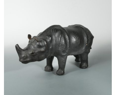 A leather clad model of a rhino, modelled standing 26 x 54cm (10 x 21in)  
