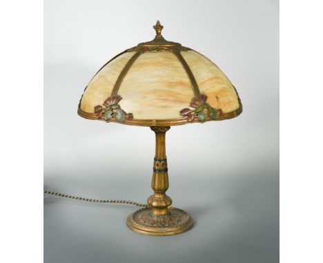 An early 20th century painted spelter and glass table lamp, the painted and gilt brass knopped column to a spreading foot, su
