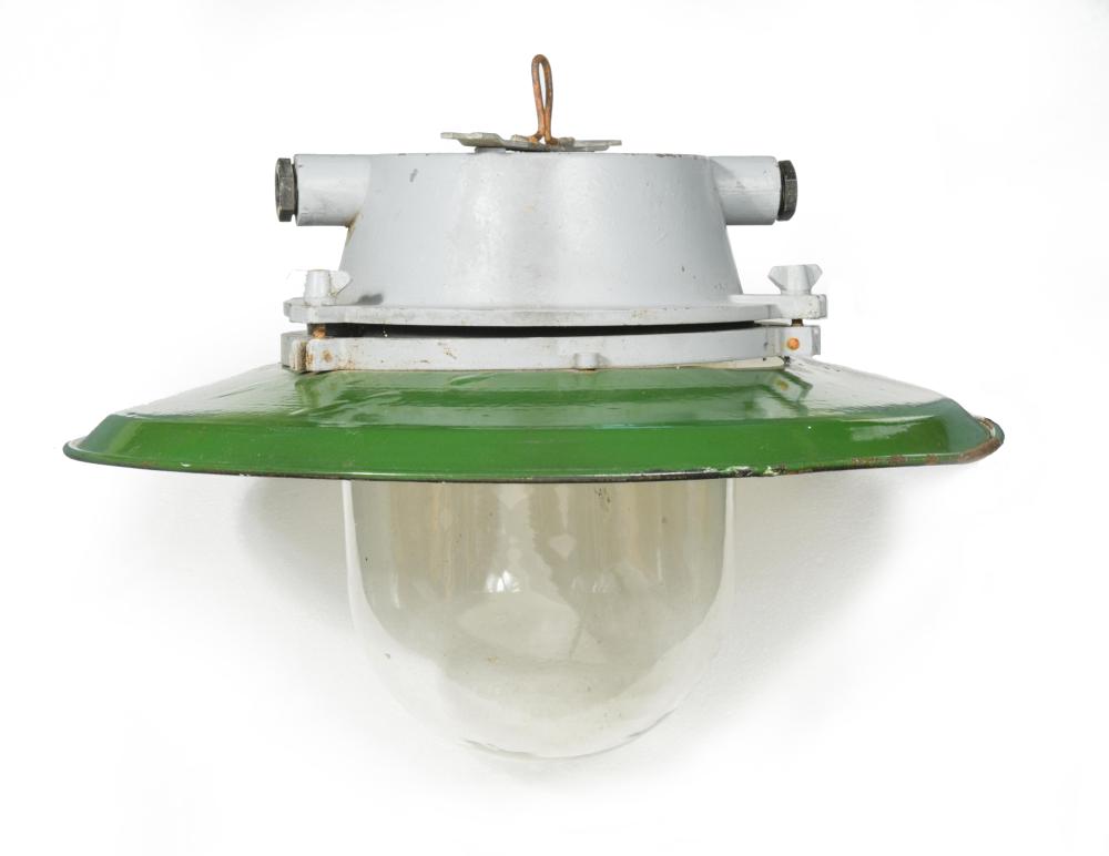 A mid-century green enamel industrial pendant light, with glass dome